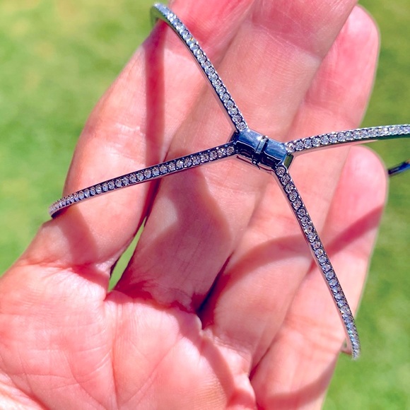 A beautiful silver bracelet with crystals on the outside of the bracelet. - Picture 5 of 8
